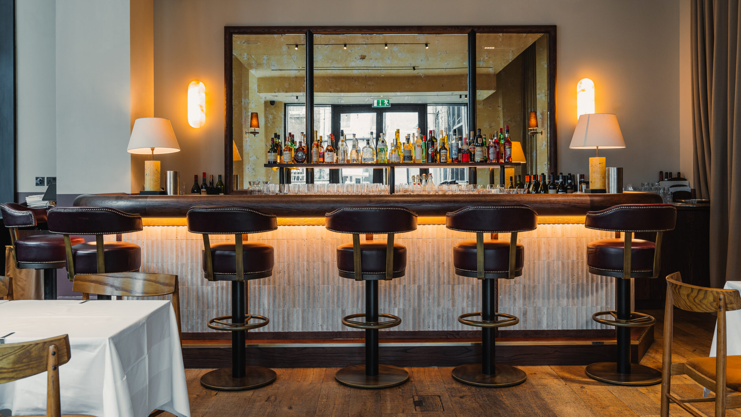 Burro Bespoke Bar. Rosso Levanto marble top. the front panelling has a subtle mosaic tile that adds a bit of texture.
