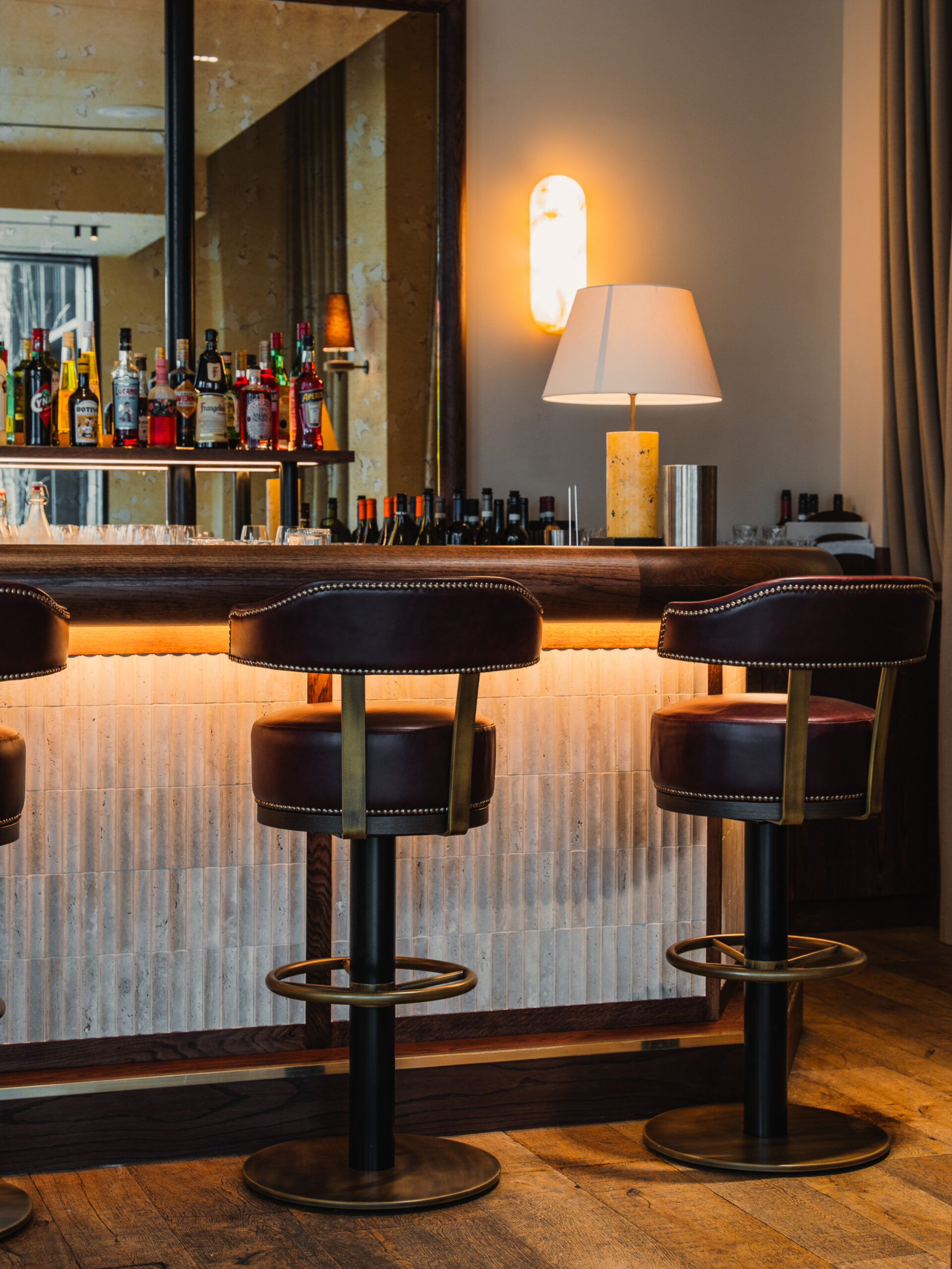 Burro Bespoke Bar. Rosso Levanto marble top. the front panelling has a subtle mosaic tile that adds a bit of texture.