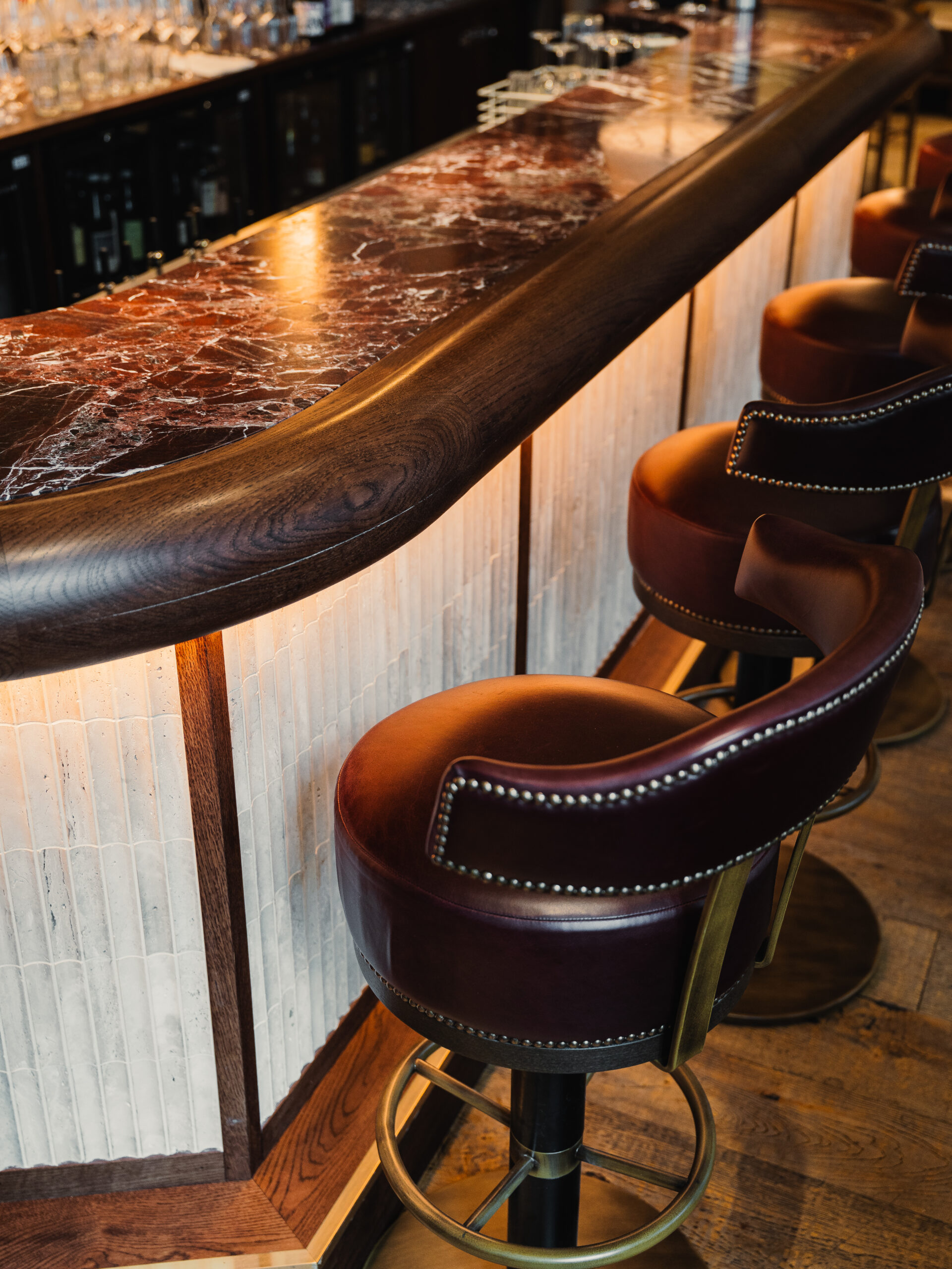 Burro Bespoke Bar. Rosso Levanto marble top. the front panelling has a subtle mosaic tile that adds a bit of texture.